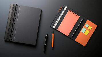 desk setup featuring notebooks, sticky notes, and pens for organization photo