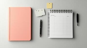 Notebook, pen, paper and notepad on a gray background 3d render photo