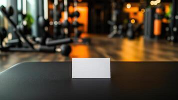 blank business card on gym bench in fitness center photo