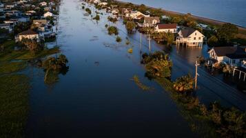 Flooded coastal town with submerged homes and streets, showcasing water damage photo