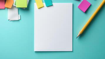 Blank paper, pencil, sticky notes and other office supplies on blue background photo