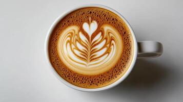 A cup of coffee with a latte art design photo