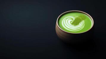 frothy matcha latte in traditional ceramic bowl, beautifully presented photo