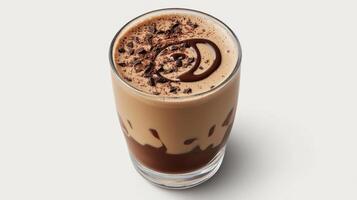 frothy glass of freshly made chocolate milk topped with chocolate shavings photo