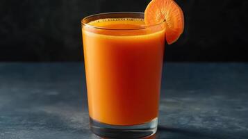 refreshing glass of fresh carrot juice garnished with slice of carrot photo