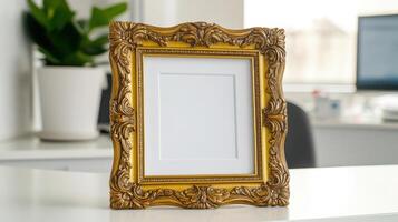 golden ornate frame with pure white interior on desk photo