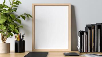 minimalist frame with blank interior on wooden desk, surrounded by stationery and plants photo