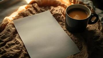 Coffee and paper on bed with sunlight photo