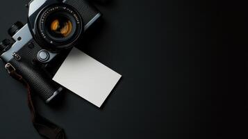 vintage camera with blank card on dark surface, ready for notes photo