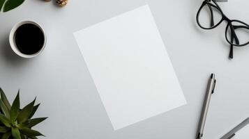 clean workspace with blank sheet of paper and coffee photo