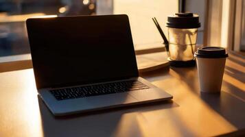 serene workspace with laptop and coffee cup photo