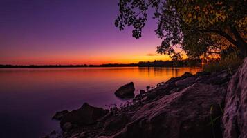 serene lake at sunset with vibrant colors reflecting photo
