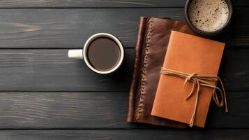 rustic workspace with coffee and leather notebook photo