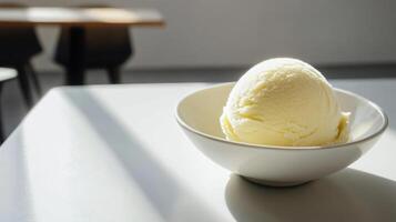 A bowl of ice cream sitting on a table photo