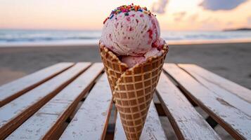 scoop of strawberry ice cream in waffle cone at sunset photo