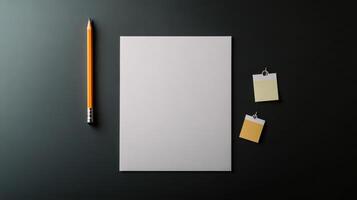 Blank paper, pencil, and sticky notes on a black surface photo