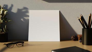 blank note paper on neat desk with plants and stationery photo