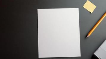 blank sheet of paper and pencil on desk photo