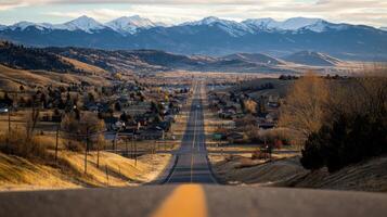 scenic view of small town with mountains in background photo