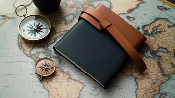 Compass, notebook and leather belt on a world map photo