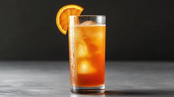 Fresh orange juice with ice and slice of orange garnish photo