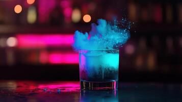 A drink with blue powder in it on a bar counter photo