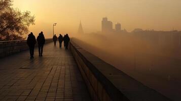 foggy morning with people walking on bridge photo
