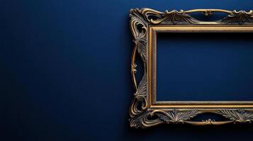 Baroque style gilded picture frame on dark blue background photo