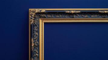 Baroque style gilded picture frame on blue wall photo