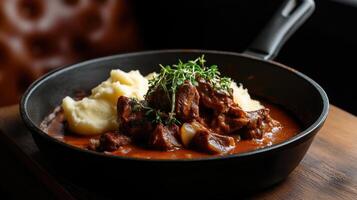 Delicious braised lamb with rich sauce and creamy mashed potatoes photo