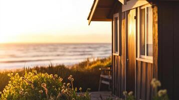 Charming seaside cottage with sunset view and coastal plants photo