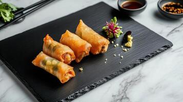 Crispy spring rolls with fresh herbs and dipping sauce photo