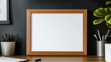Mockup of a blank white frame on a desk with a plant and a notepad photo