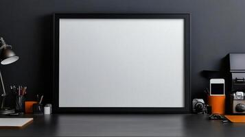 Blank frame mockup on a desk with a computer, phone and other items photo