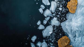 Melting ice chunks and rocks dark water surface create serene view photo