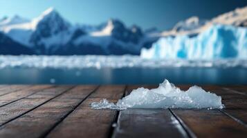 Iceberg on wooden floor with mountains in the background photo