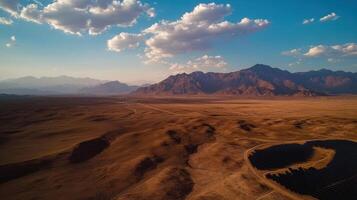 vast desert landscape with solar panels and mountains photo