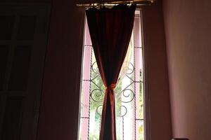 A window with a curtain photo