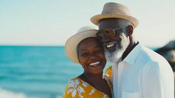 An elderly couple smiling and hugging while enjoying a sunny day at the beach, representing love and relaxation in retirement. photo