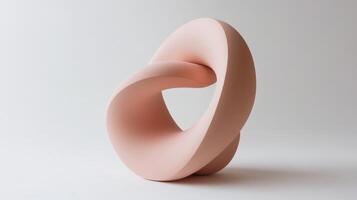 Unique sculpture featuring a smooth and flowing design, showcasing modern art aesthetics in a minimalist setting photo