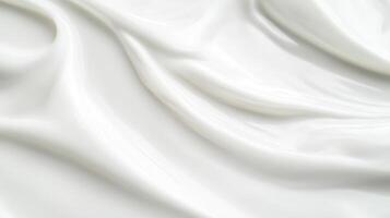 Smooth, creamy texture of fresh white fabric draped elegantly on a flat surface captures the essence of luxury and comfort in a minimalist setting photo