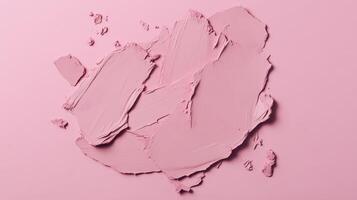 Soft pink paint swatches spread artistically across a pastel background highlighting texture and color variation photo