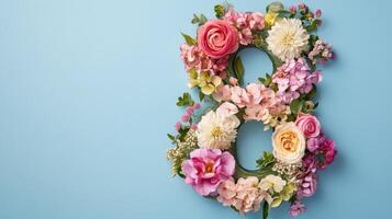 Colorful floral arrangement in the shape of number eight displayed against a light blue background for a special event celebration photo