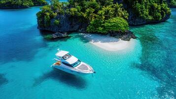 Luxury Yacht Moored at Secluded Tropical Island Beach Paradise with Crystal Clear Turquoise Waters photo