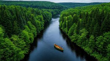Serene Wooden Canoe on a Calm River Surrounded by Lush Green Forest Landscape photo