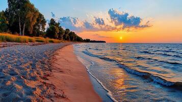 Stunning Sunset over Sandy Beach with Calm Ocean Waves and Lush Green Trees photo
