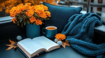 Cozy Autumn Scene Book Tea Flowers and Knitted Blanket on Balcony photo
