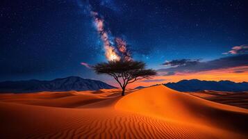 Majestic desert landscape at sunset with a lone tree under a breathtaking starry sky and the Milky Way galaxy photo