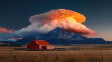 Dramatic Sunset over Mountain Range with Red Barn and Fence Stunning Landscape photo