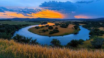 Scenic River Landscape at Sunset Golden Hour over Serene Waterway and Lush Meadows photo